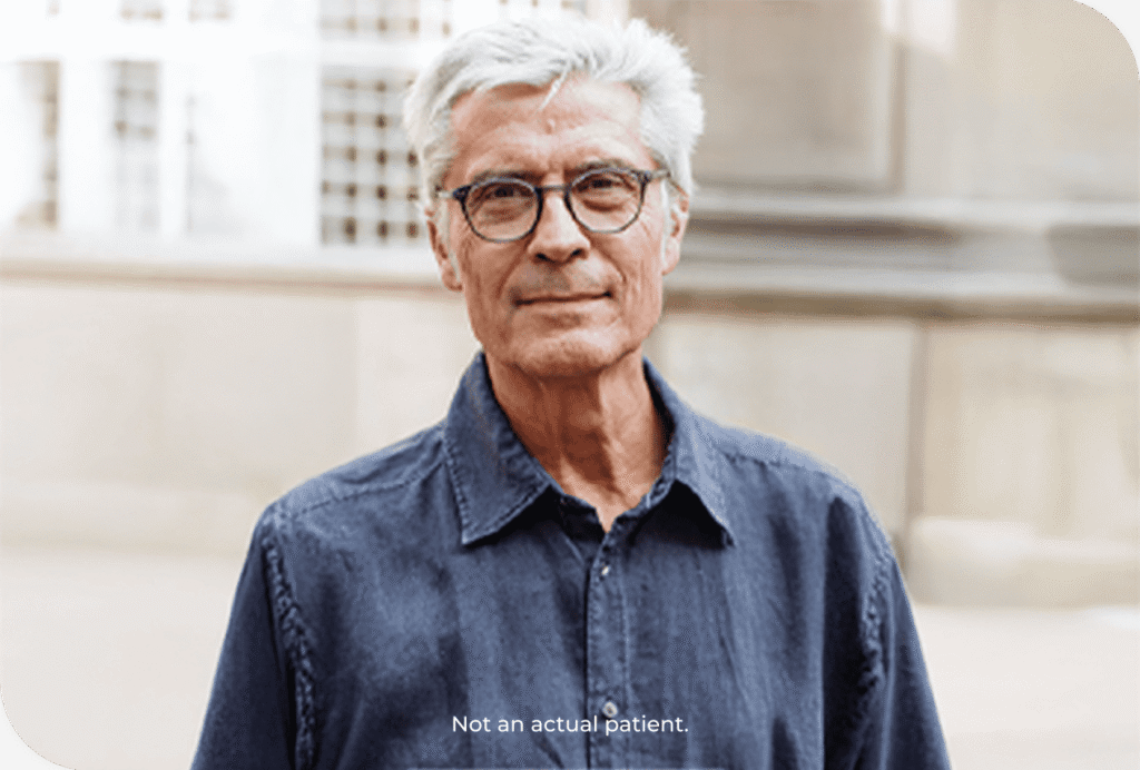 Man with glasses standing
